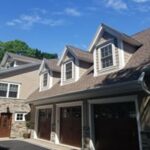 after photo showing side angle view of 3 car garage